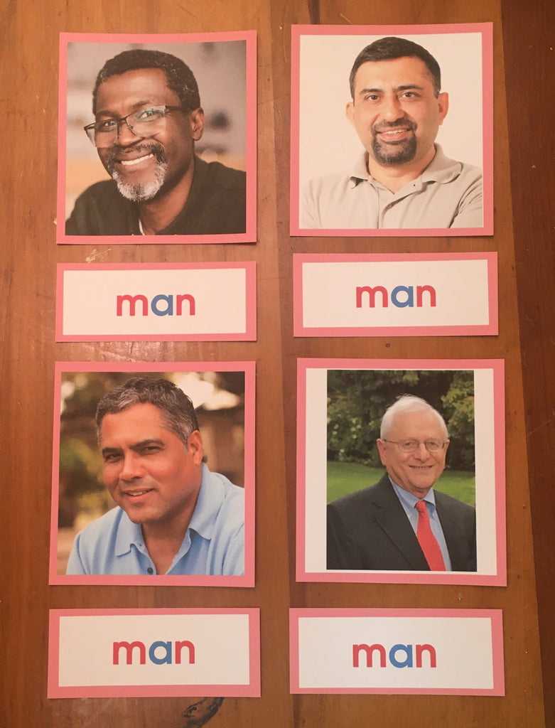 Collection of 4 pictures of a man, each one a different race, with a pink boarder around each photo.  Four labels with the word man are below each picture the word man is written with blue for vowels and red for consonants.