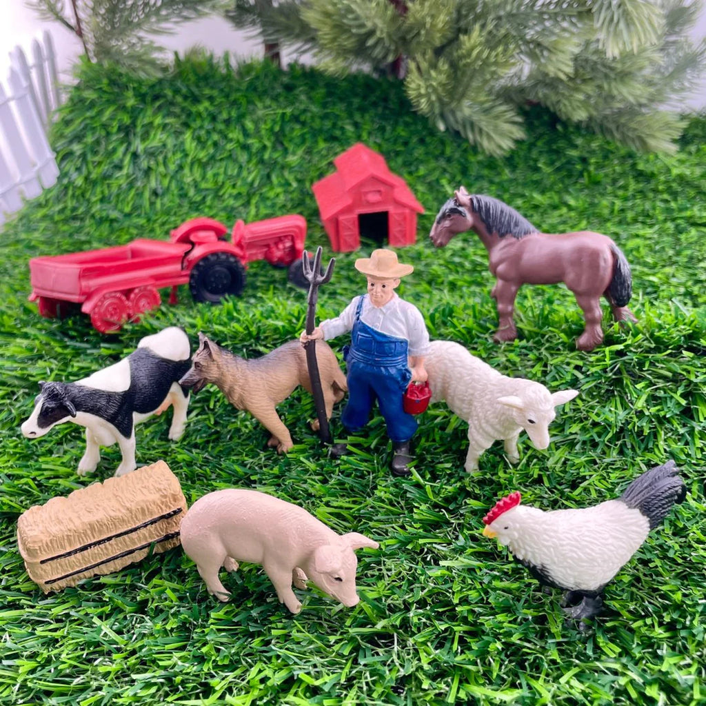 A collection of toy farm animals including a cow, horse, farmer, pig, hay bale, sheep, tractor, and a chicken displayed on a green surface.